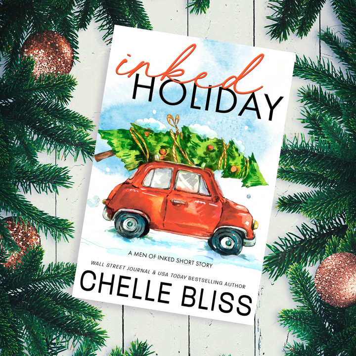 inked holiday paperback book red car with christmas tree on roof 