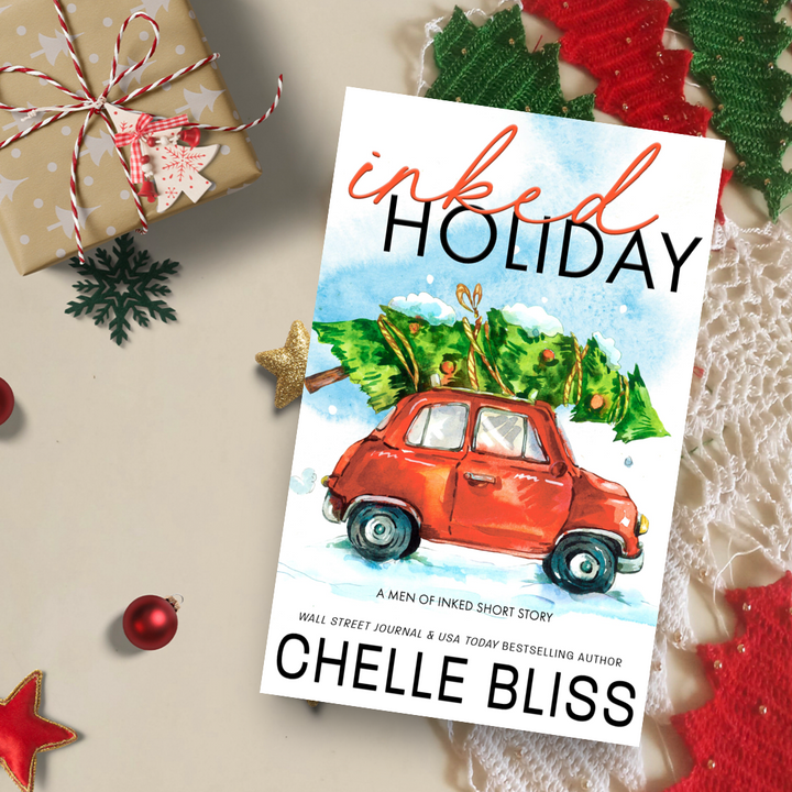 inked holiday paperback book red car with christmas tree on roof 