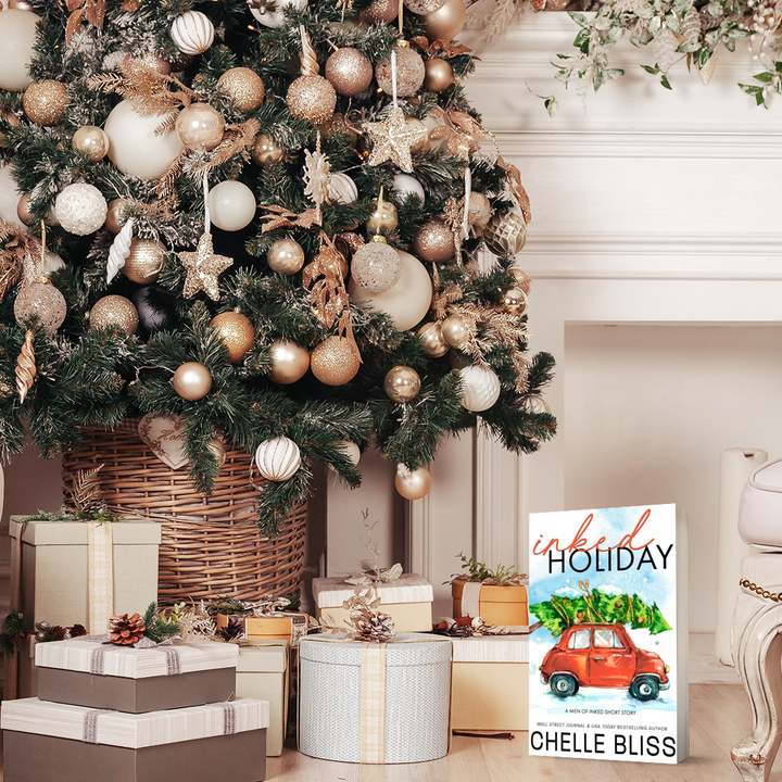 inked holiday paperback book red car with christmas tree on roof 