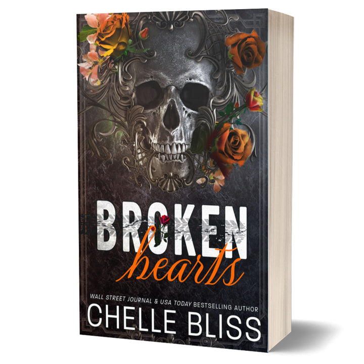 paperback book Broken Hearts Discreet edition by Chelle Bliss featuring a skull and orange flowers on the cover with a white background.