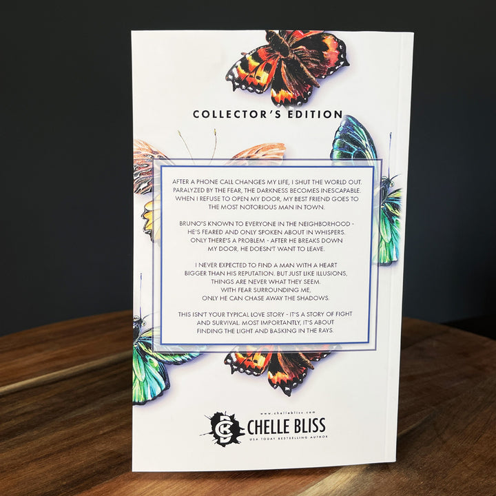 Collector's Edition Enshrine Paperback back page featuring butterflies 