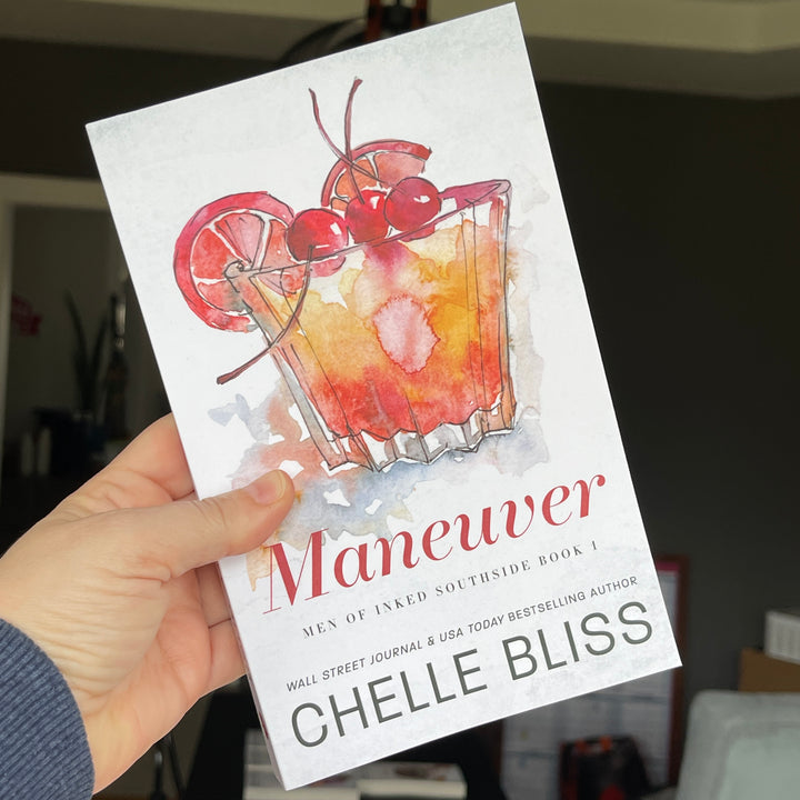 paperback book maneuver whiskey glass chelle bliss 