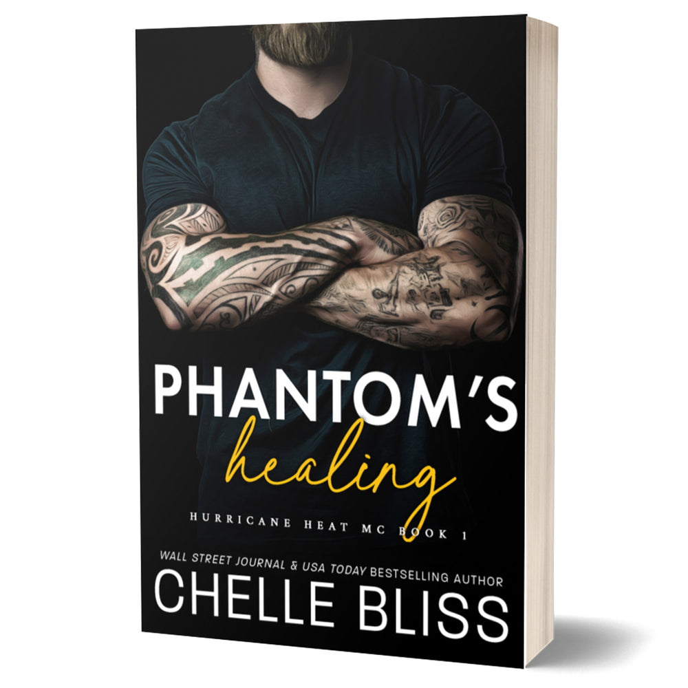 Book cover of 'Phantom's Healing' by Chelle Bliss with a person with tattoos on the arms.