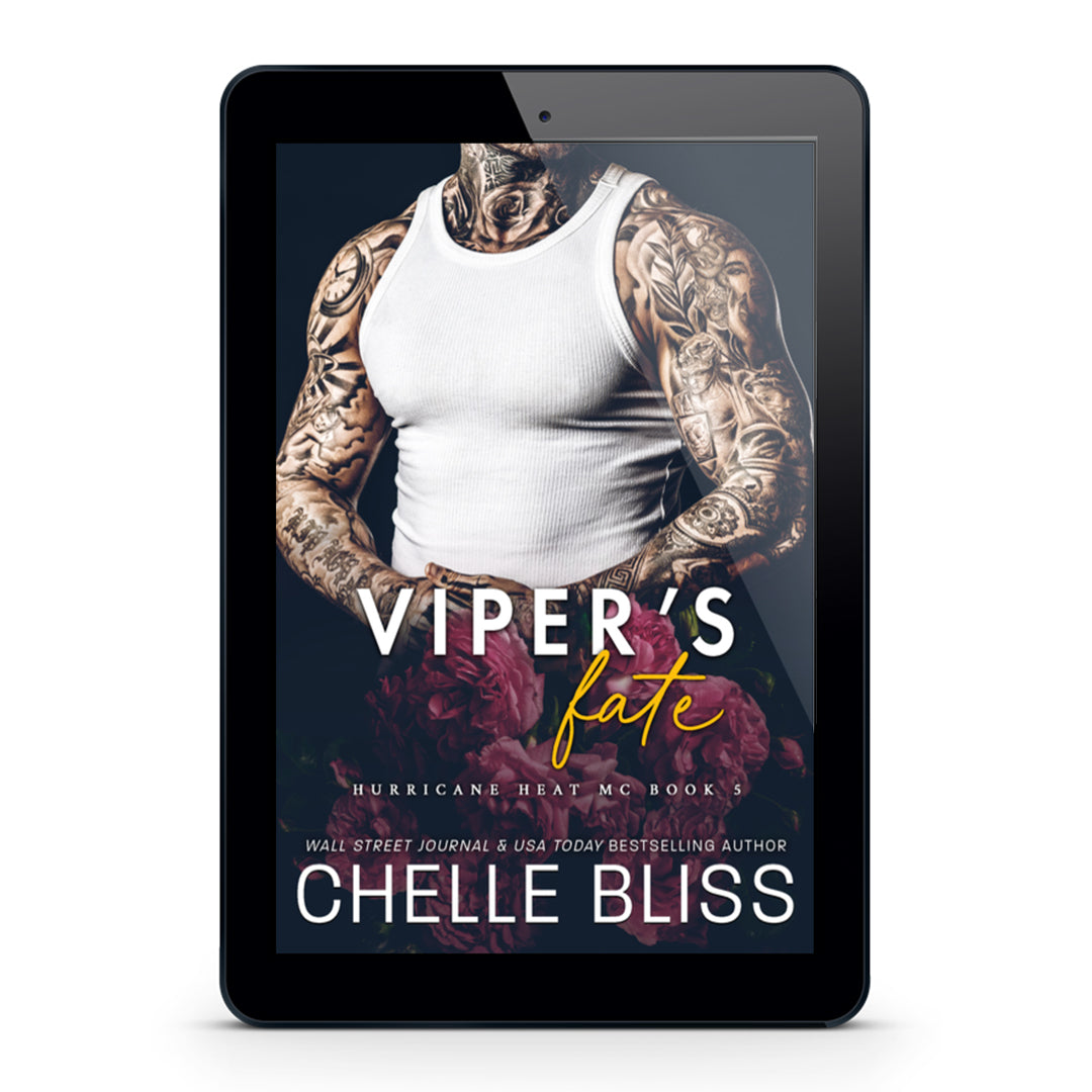 A tablet device centered on a light gray background, displaying a romance novel cover titled "Viper's Fate" by Chelle Bliss. The cover shows a tattooed man in a white tank top with dark red roses at the bottom.