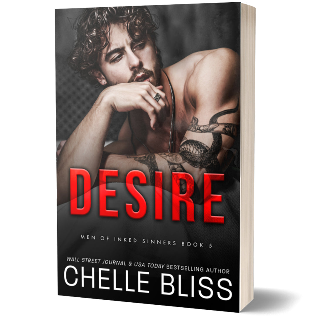 Book cover of 'Desire' by Chelle Bliss featuring a shirtless man with tattoos.