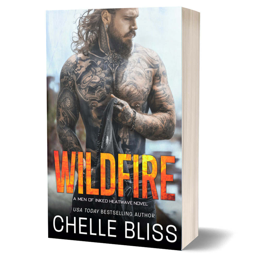 wildfire paperback book shirless tattooed man at beach 