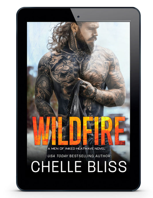 Wildfire eBook - Tattooed Man with long brown hair holding a t-shirt
